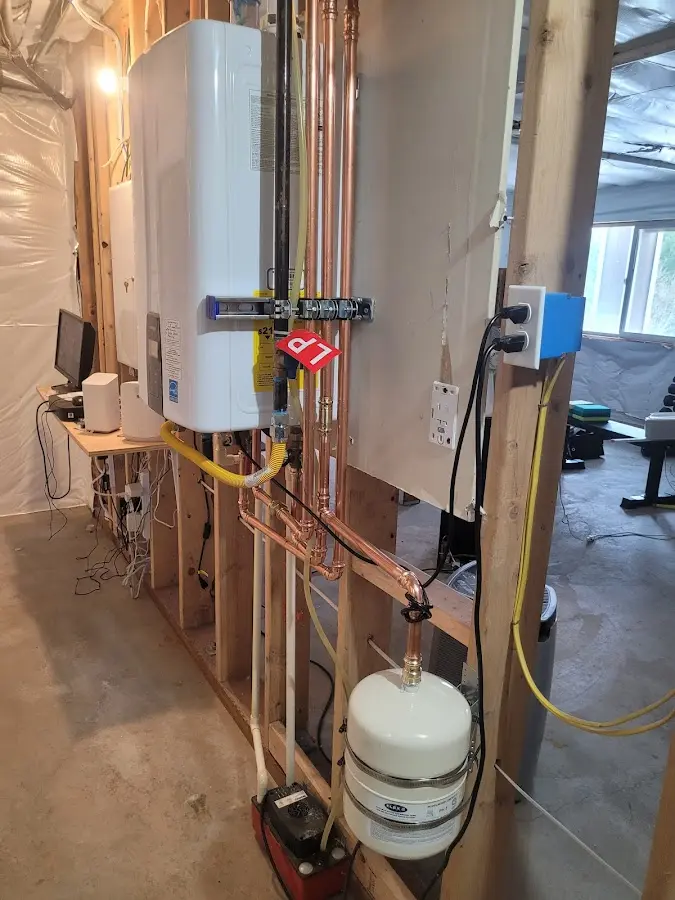 Licensed plumber repairing a kitchen sink in Stockbridge