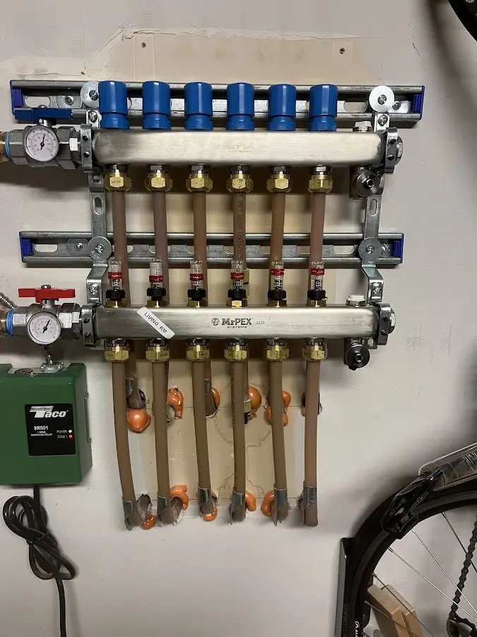 Plumber performing Water Heater Repair at a residential property in Stockbridge